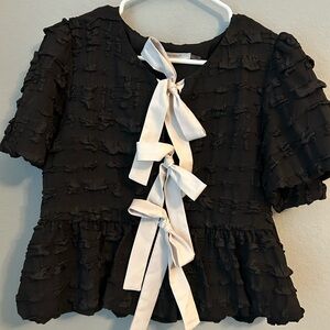 Black Textured Peplum Top with White Bows